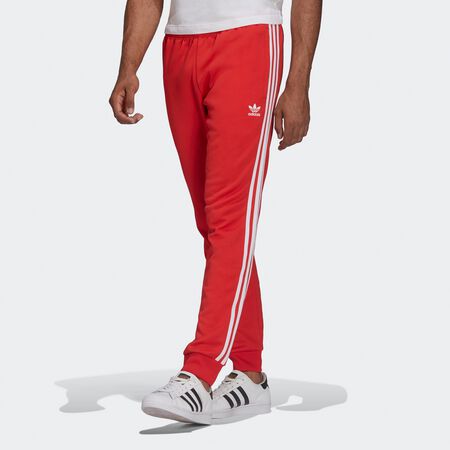 Compra adidas Originals Pantalon de adicolor Slim vivid red snse-navigation-south en SNIPES