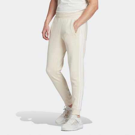 Compra adidas Pantalón chàndal adicolor 3-Stripes Slim Fleece wonder white Online Only en SNIPES